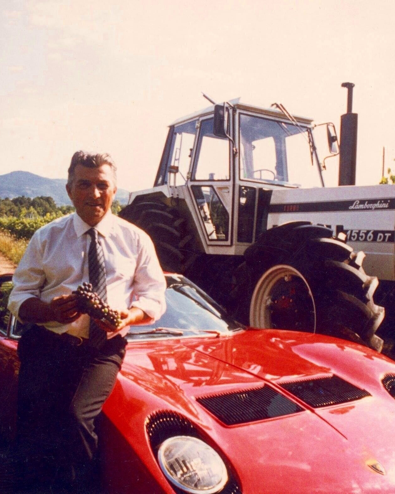 Ferruccio Lamborghini beside a Miura and Lamborghini tractor